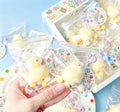 fluffy yellow duck squishy keychain